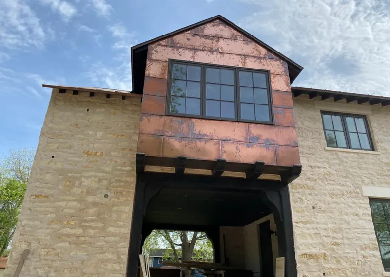 Copper metal panel facade on a stone building for Skylight Installation in Indian Trail